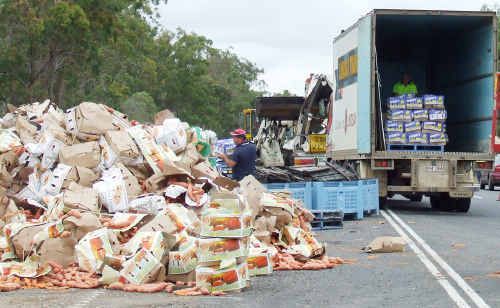 A load of sweet potatoes toppled out of a B-Double truck when it rolled on the Bruce Highway at Aldershot yesterday; the clean-up took hours. A load of sweet potatoes toppled out of a B-Double truck when it rolled on the Bruce Highway at Aldershot yesterday; the clean-up took hours.